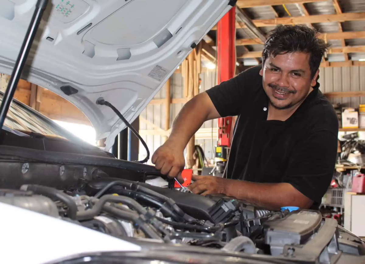 Certified mechanic performing engine diagnostics at Toyo Tec Auto Repair in Cypress, TX
